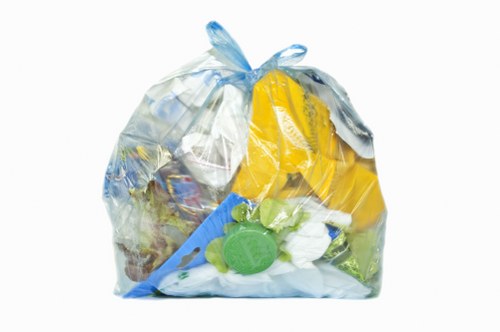 Crew segregating different types of business waste at pickup point