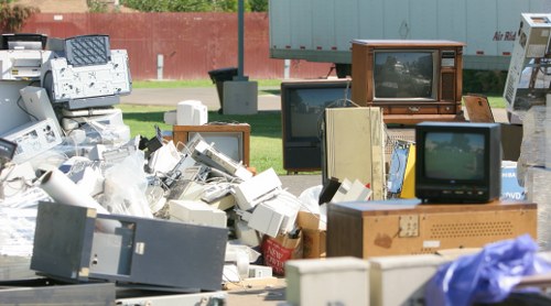 Business waste items lined up for collection in a busy Tower Hamlets street